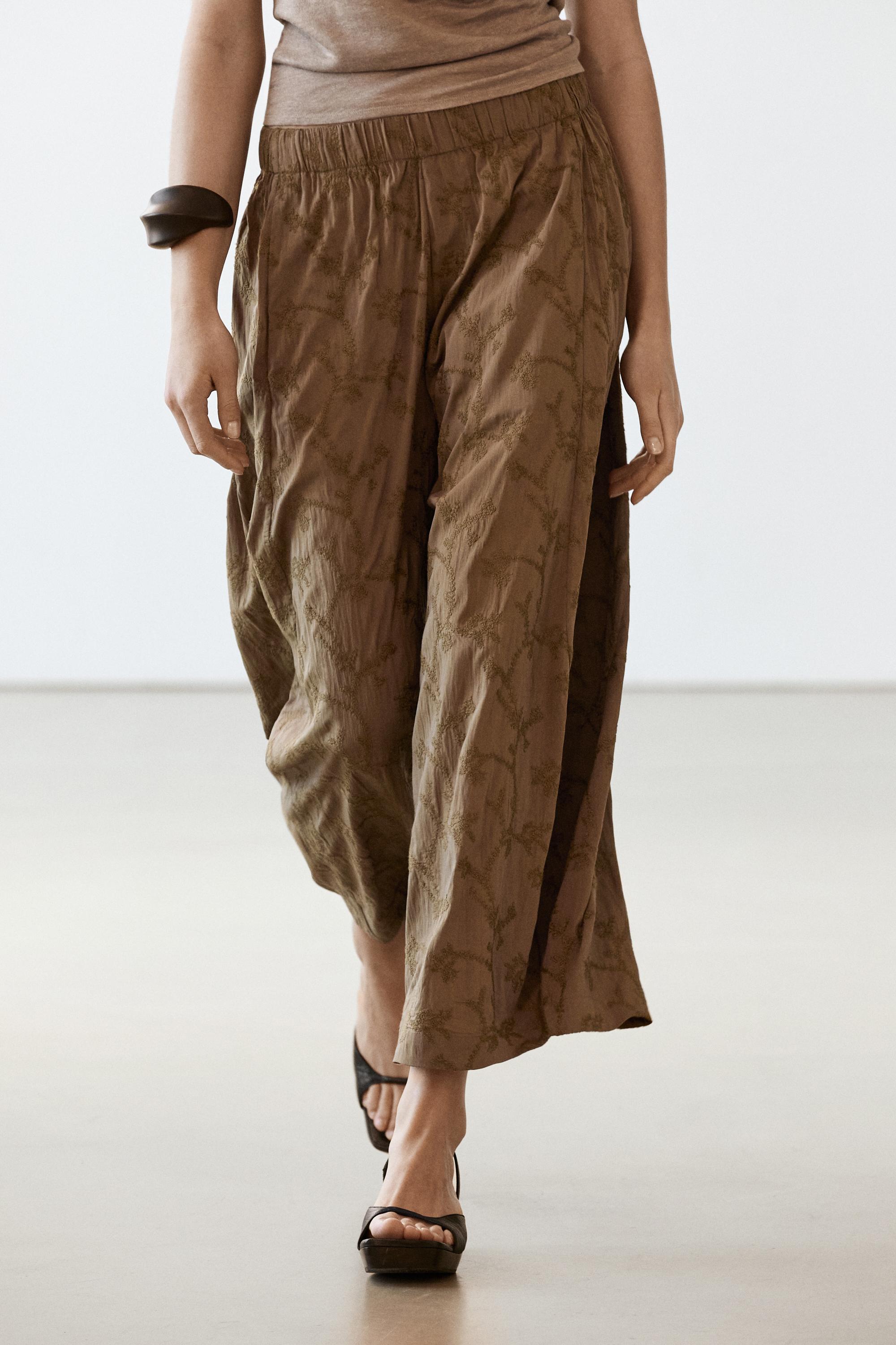 Trousers with embroidered detail and elastic waistband